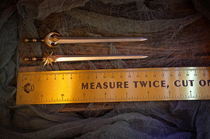 Measurement of sword pins (~15.5 cm) next to a ruler.
