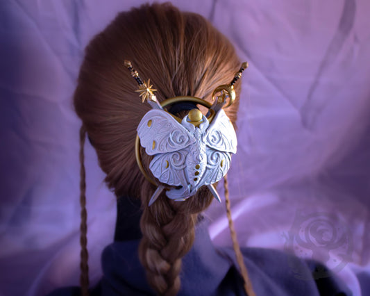 White (Exalted/Marble) moth shown in hair.